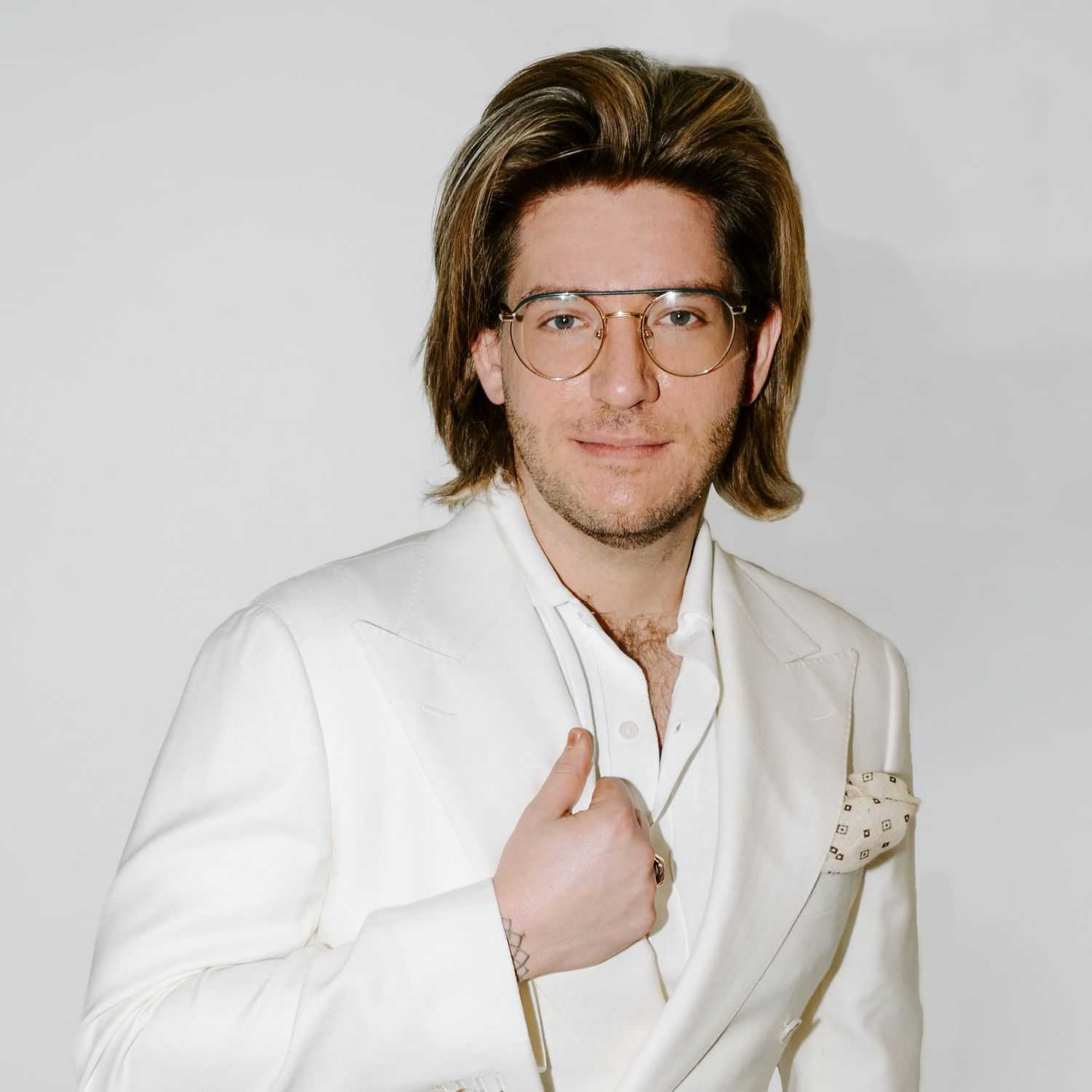 Portrait of Wes, a professional stylist at Bob Steele Salon, showcasing their expertise and style.