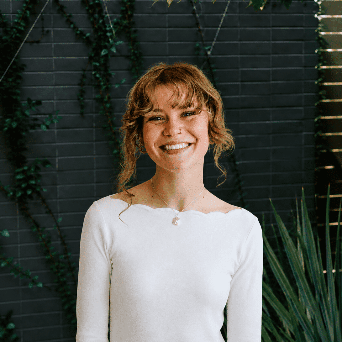 Portrait of Bobbi, a professional stylist at Bob Steele Salon, showcasing their expertise and style.