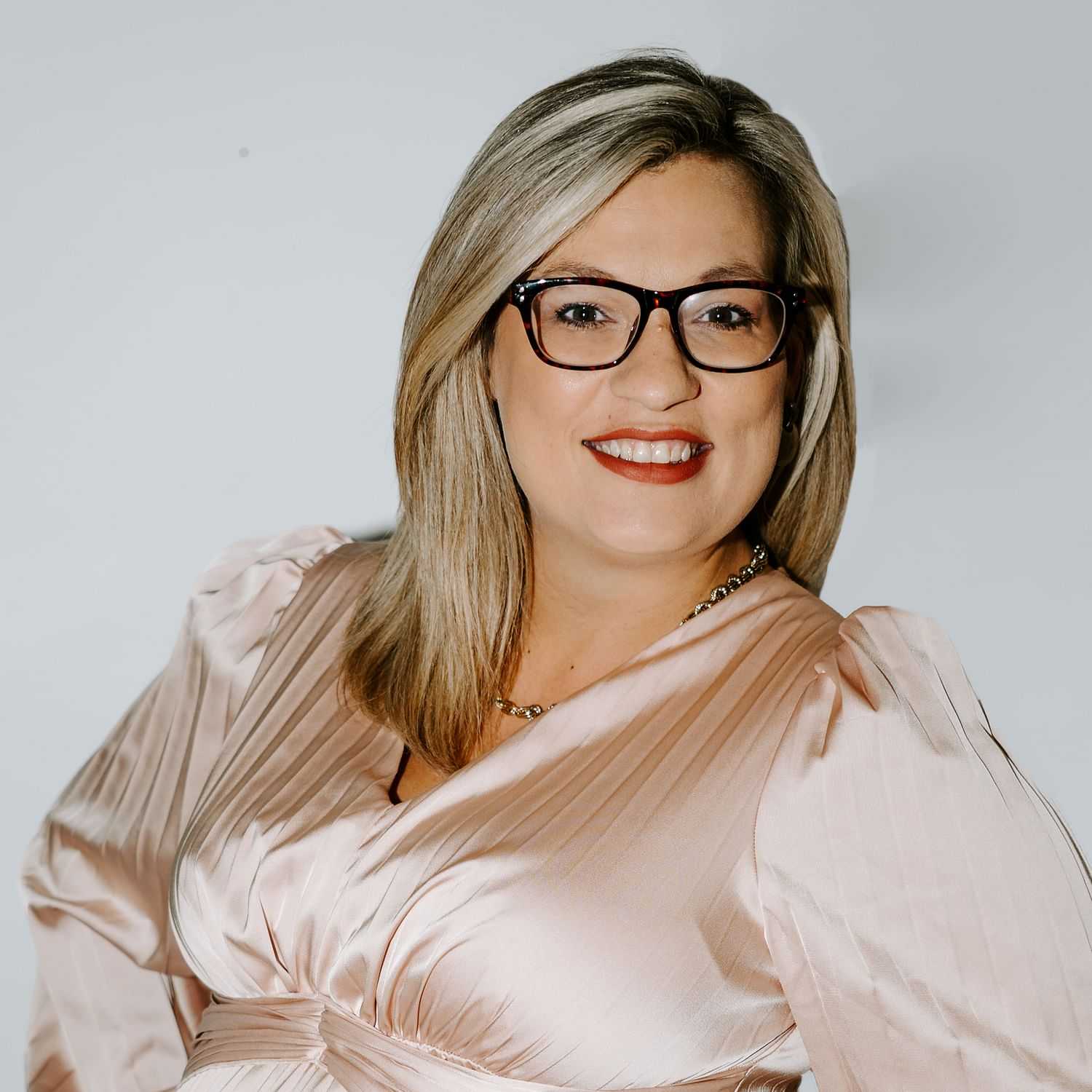 Portrait of Maria, a professional stylist at Bob Steele Salon, showcasing their expertise and style.