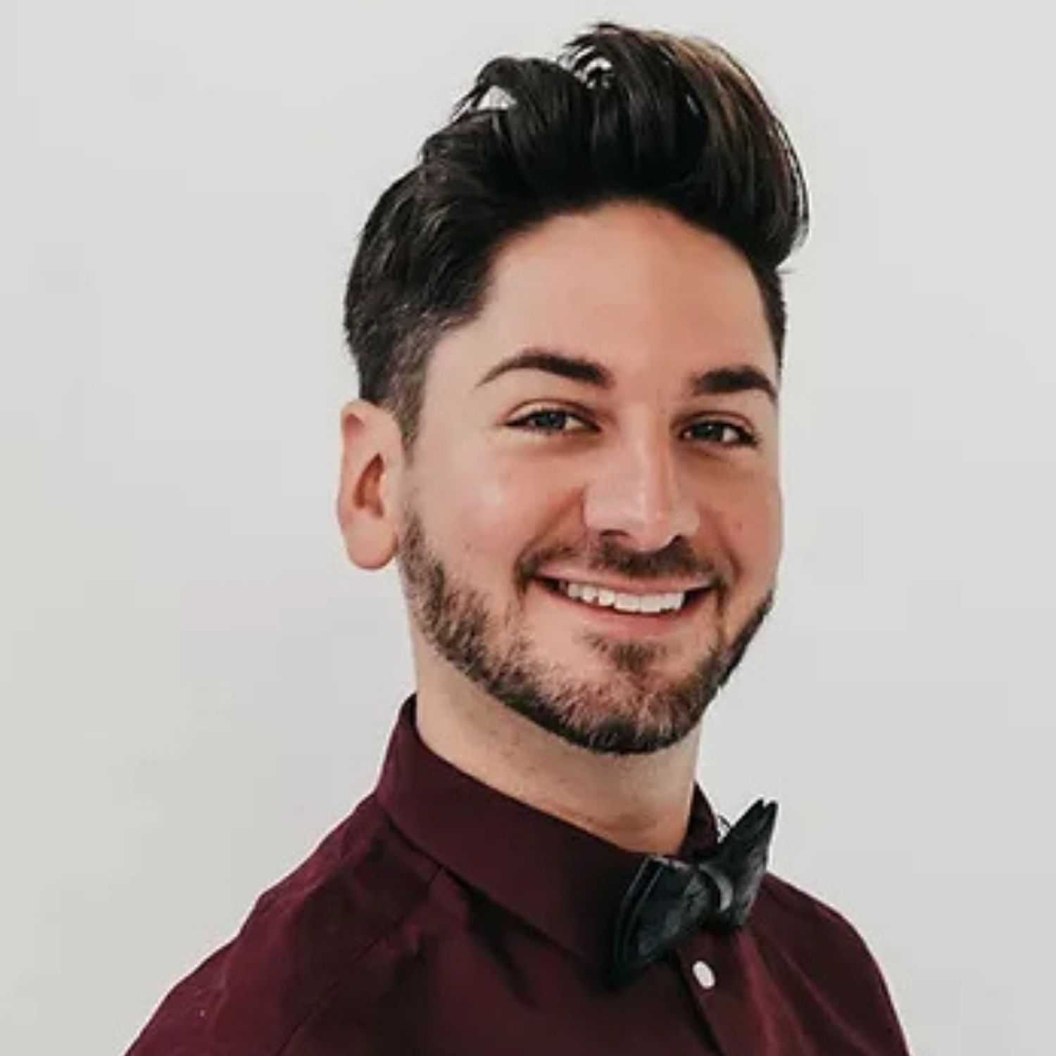 Portrait of Ricky, a professional stylist at Bob Steele Salon, showcasing their expertise and style.