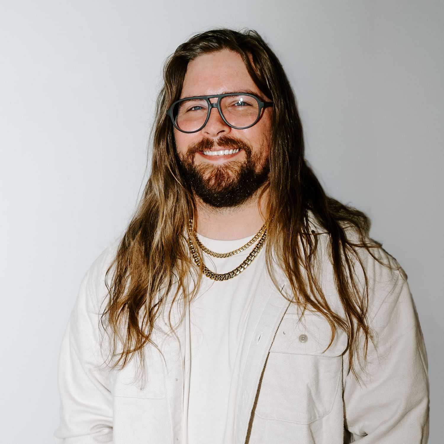 Portrait of Liam, a professional stylist at Bob Steele Salon, showcasing their expertise and style.
