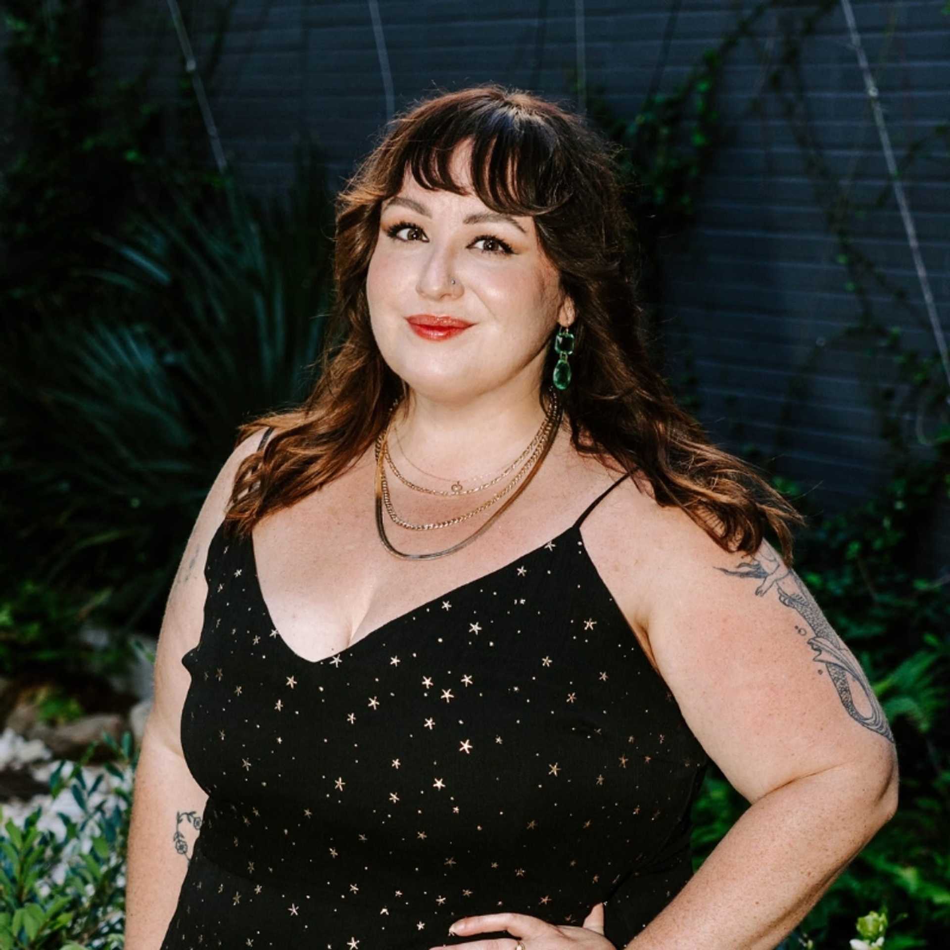 Portrait of Bella, a professional stylist at Bob Steele Salon, showcasing their expertise and style.